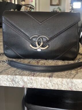 CHANEL Black Chevron Caviar Shoulder Bag with Silver-Tone CC